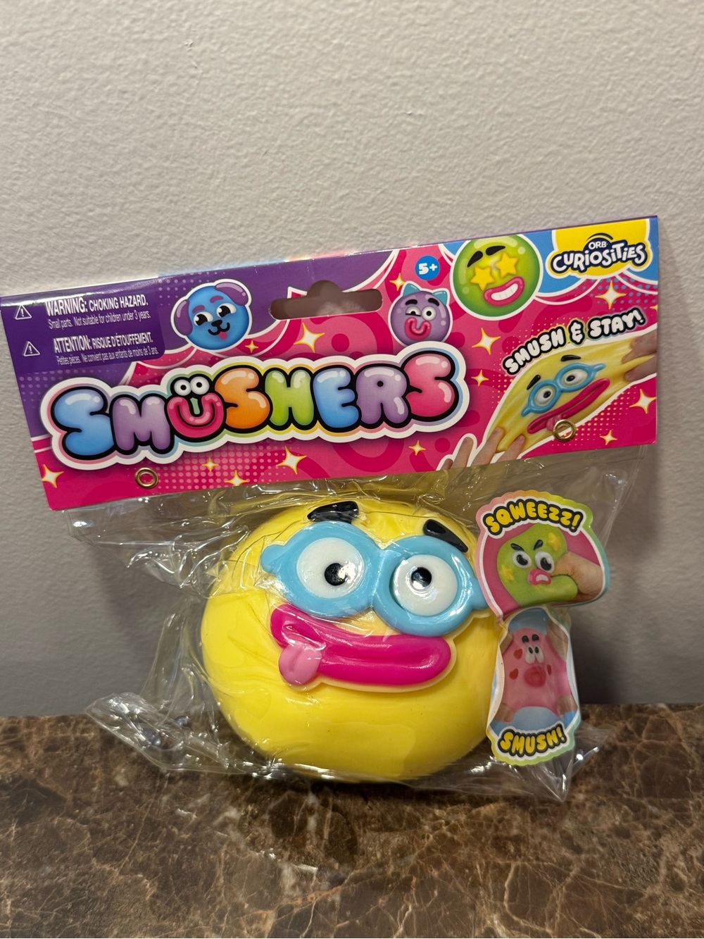 Orb Smushers Yellow Squeeze with glasses & funny face. Kids FAVORITE to collect